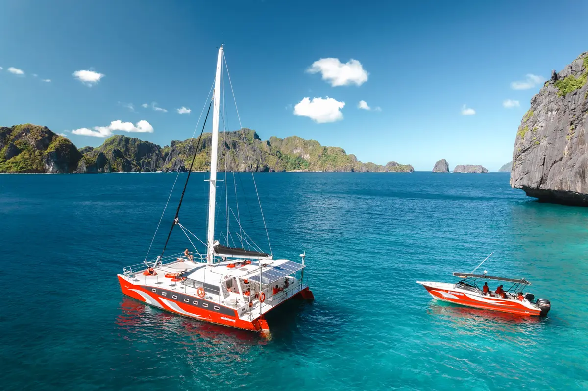 Seaduction speedboat and luxury catamaran in El Nido